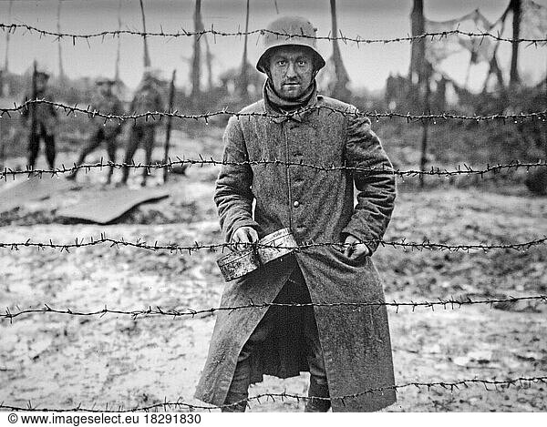 WWI German Prisoner Of War Behind Barbed Wire Of POW Camp At Langemarck