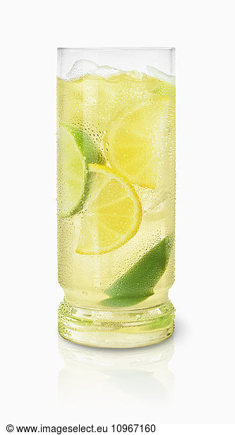 'A glass of a cold beverage with ice cubes and wedges of lemon and lime; Toronto  Ontario  Canada'