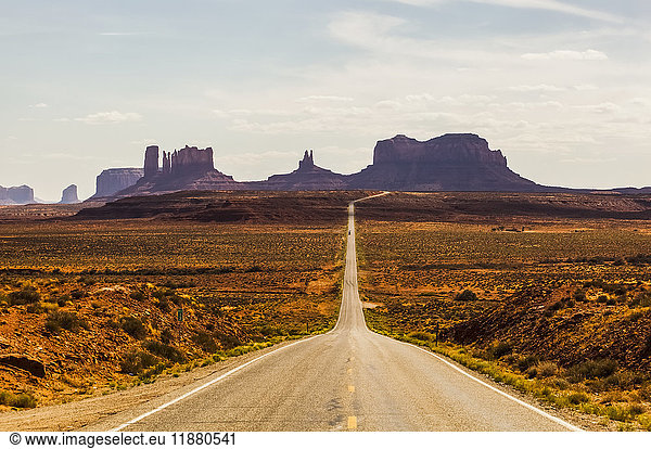 'A road leading to rugged rock formations in the desert; Arizona  United States of America'