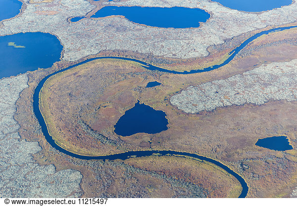 'Aerial view of a stream that runs through a tundra landscape filled with small ponds  Yukon Delta  Arctic Alaska; Saint Mary's  Alaska  United States of America'