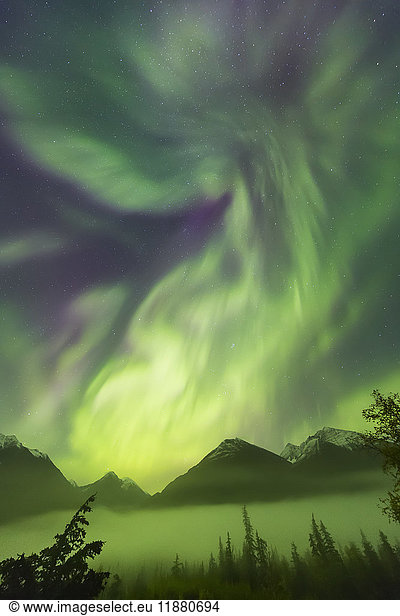 'Bright green aurora borealis dances over the Kenai Mountains  Moose Pass  Kenai Peninsula  South-central Alaska; Alaska  United States of America'