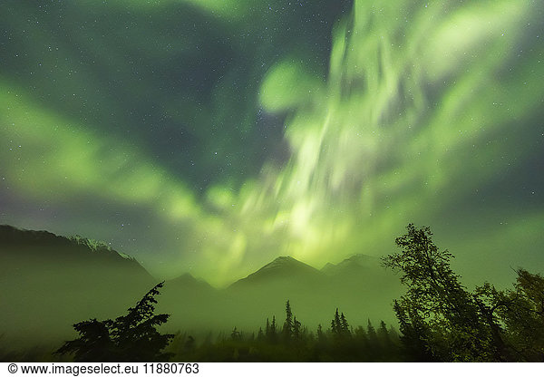 'Bright green Aurora Borealis dances over the Kenai Mountains  Moose Pass  Kenai Peninsula  South-central Alaska; Alaska  United States of America'