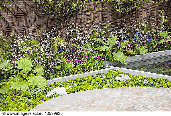 'Chelsea Flower Show 2013  B&Q Sentebale EForget-me-noti Garden  Designer Jinny Blom. Sentebale is Prince Harry´s charity. Silver Gilt Flora medal'