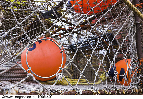 'Crab pots and bouys stacked on shore  St. Paul Harbor  St. Paul Island  Southwestern Alaska  USA'