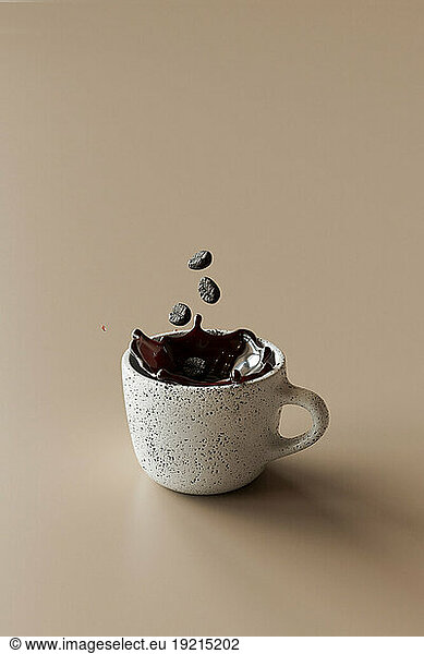 3D render of coffee beans falling into mug of coffee