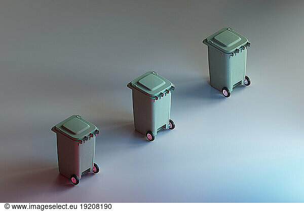 3D render of row of wheeled garbage cans