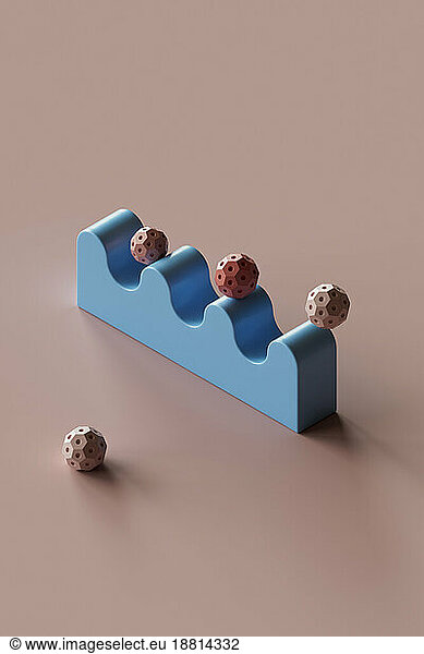 3D render of spheres bouncing on wavy object