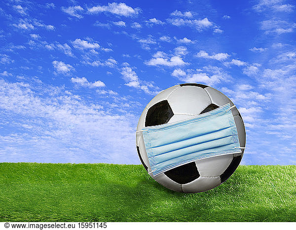 3D rendering  Soccer ball covered by surgigal mask on soccer field