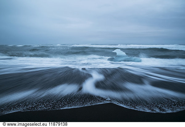 'Diamond Beach  along the South coast and is an area where ice chunks from Jokulsarlon are deposited on the beach after each high tide; Iceland'