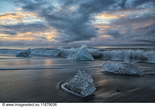 'Diamond Beach  along the south Coast of Iceland and is an area where ice chunks from Jokulsarlon are deposited on the beach after each high tide; Iceland'
