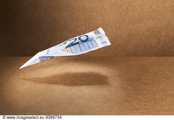 20 Euro note folded into paper airplane