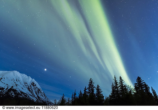 'Faint green Aurora Borealis dances over the Kenai Mountains  Moose Pass  Kenai Peninsula  South-central Alaska; Alaska  United States of America'