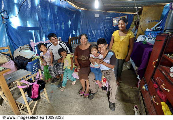 'Family in humble shack  slum ''200 Zone D'' Huaycan  Lima  Peru  South America'