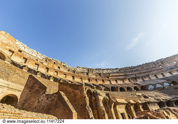 'Looking up at the high walls of the Colosseum in Rome on a sunny summer day; Rome  Italy'