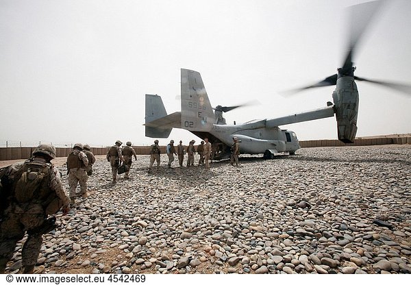 100522-M-7069A-019 U S Marines  sailors and civilians upload onto an MV-22 Osprey aircraft at Forward Operating Base Sher Wali  Afghanistan  on May 22  2010