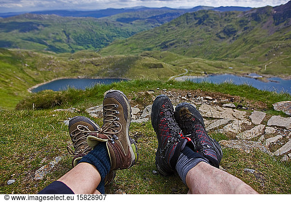 2 people's walking boots on a break on Snowdonia