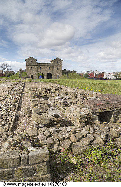 'Pile of stones at Arbeia Roman Fort with buildings in the background; South Shields  Tyne and Wear  England'