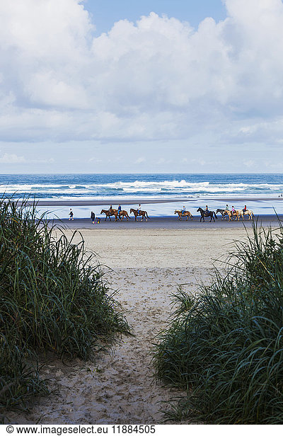 'Riding horseback on the beach along the Oregon Coast; Bandon  Oregon  United States of America'