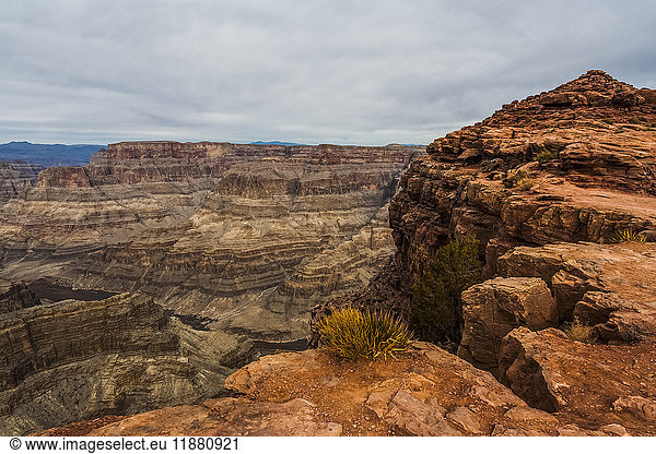 'Rugged landscape with rock showing layers of sediment and erosion; Arizona  United States of America'