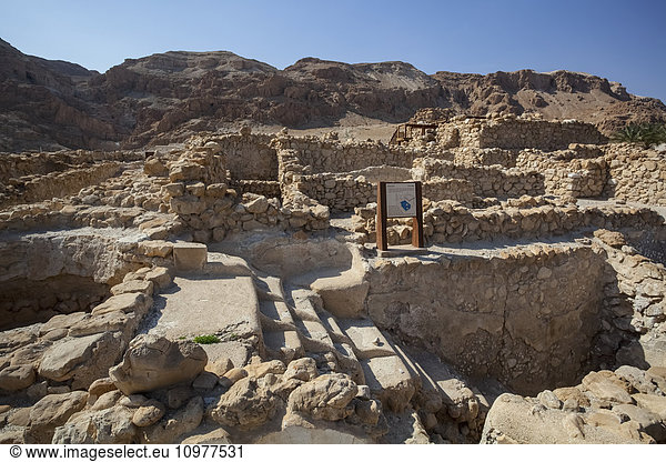 'Ruins of the Qumran community  with steps leading down used for ritual baths and the dividers on each step were to ensure the impure descending did not touch the cleansed coming up the stairs; Qumran  Israel'