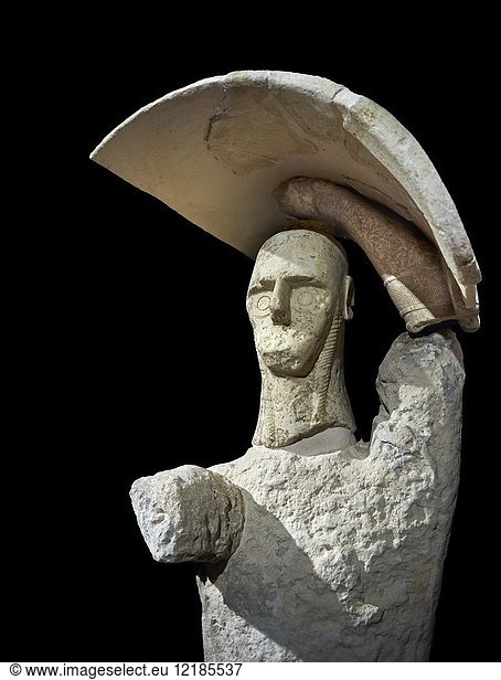 9th century BC Giants of Mont'e Prama Nuragic stone statue of a boxer  Mont'e Prama archaeological site  Cabras. 2014 excavation. Civico Museo Archeologico Giovanni Marongiu - Cabras  Sardinia. Black background.