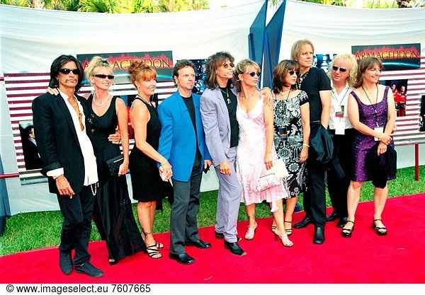 06/29/1998 __ The rock band Aerosmith  with their guests  stop on the red carpet entrance to the site of the world premiere of the movie Armageddon  which was held at the Kennedy Space Center in Florida. A special theater was constructed for the premiere outside the Apollo/Saturn V Center. The band  which provided four songs for the film´s soundtrack  performed at a private party on the site after the screening. Lead vocalist Steve Tyler middle is the father of one of the stars of the movie  Liv Tyler. The movie was partly filmed at KSC  and as part of the premiere festivities  guests had a chance to see many of the sites actually used in the film as well as explore a wide range of NASA artifacts and displays.