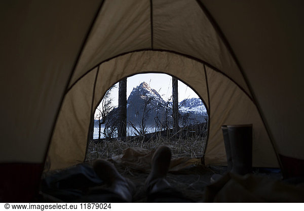'View from inside a tent through the door to the rugged peaks of the Kenai Mountains  Kachemak Bay State Park; Alaska  United States of America'
