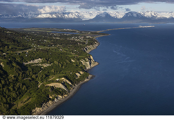 'View of the shoreline of Kachemak Bay with the Kenai Mountains in the distance; Homer  Alaska  United States of America'