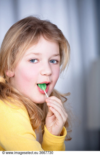 8-year-old girl with lollipop