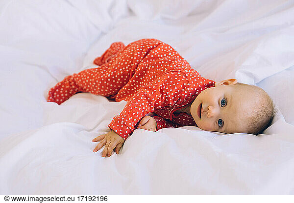 a baby in the bed