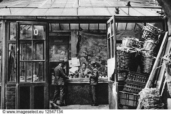 A bar in the Central Market quarter  Paris  1931.Artist: Ernest Flammarion
