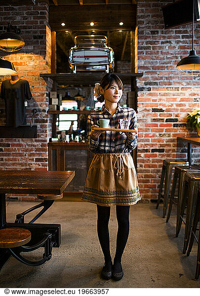 A barista at a coffee shop in Vancouver  BC  Canada.