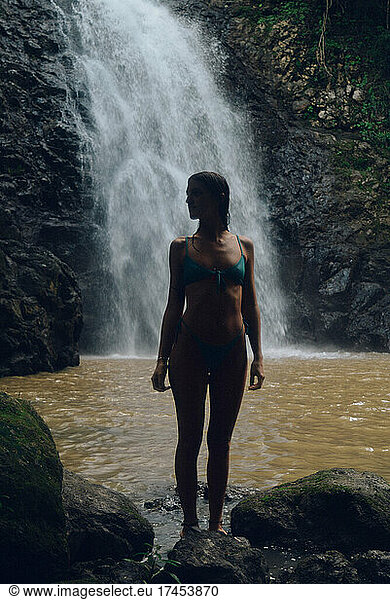 a beautiful girl enjoying a day in the waterfalls