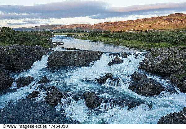 A beautiful waterfall in evening light in Iceland. Glanni waterfall.