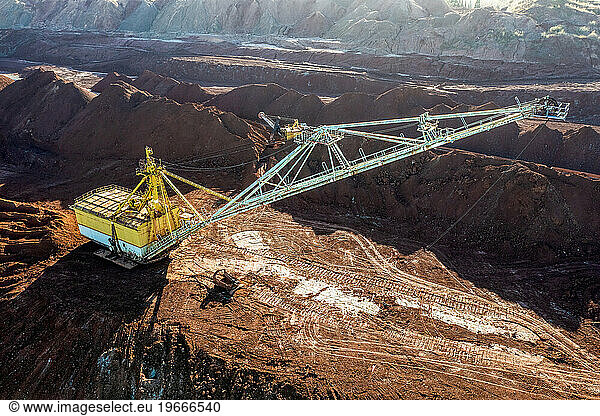 A big excavator mining clay.