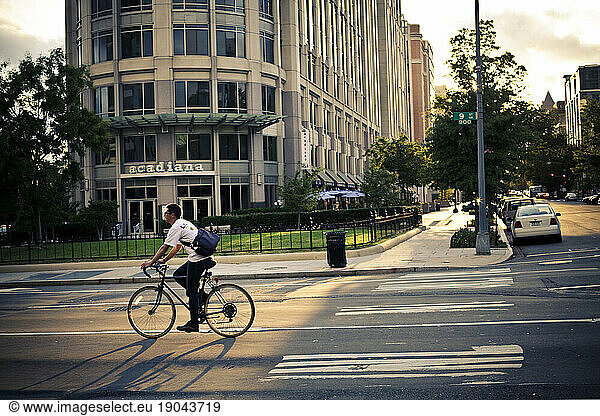 A bike rider on the streets.