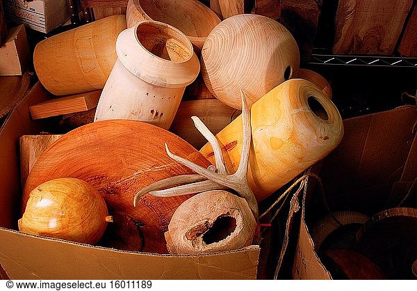 A bin filled with wooden objects