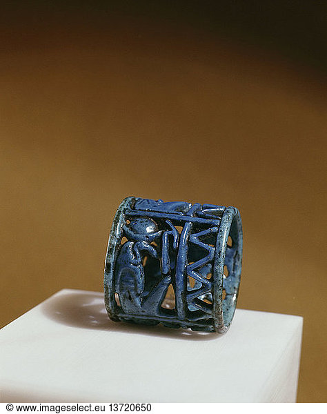 A blue faience amuletic finger ring with figures of Thoth  Horus and Isis incorporated in the design  Egypt. Ancient Egyptian. 21st 22nd dynasty c 1085 730 BC. Tuna el Bebel.