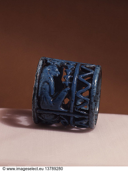 A blue faience amuletic finger ring with figures of Thoth  Horus and Isis incorporated in the design  Egypt. Pharaonic. 21st 22nd dynasty c 1085 730BC. Tuna el Bebel.