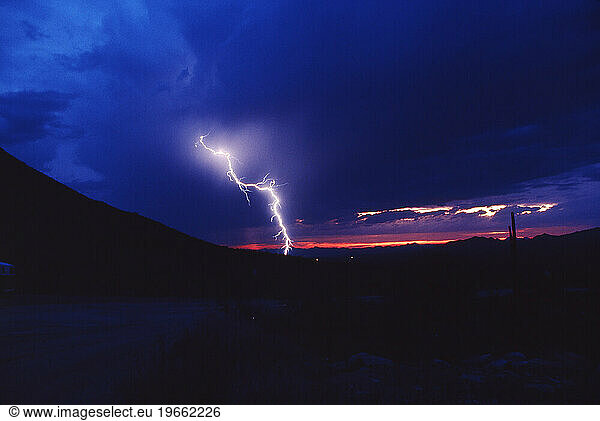 A bolt of lightning at dusk in Southern Arizona.