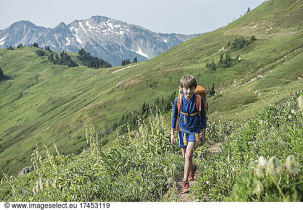 A boy backpacking in Glacier Peak Wilderness Area.