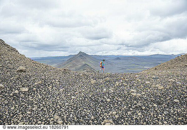 A boy hiking in the northern mountains of Iceland