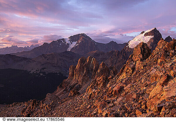 A brilliant sunrise paints the Fitzroy massif as epic clouds qui