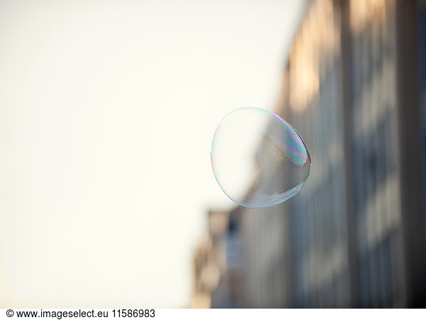 A bubble floating in an urban environment