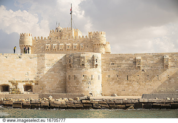 A castle surrounded by a fortress wall in Alexandria  Egypt