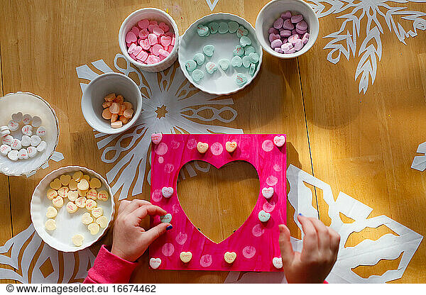 A Child Making a Picture Frame for Valentine's Day