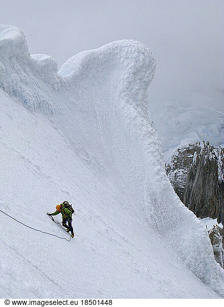 A climber negotiates a snow slope on the north ridge of Cerro Standhardt.