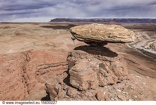 A climber takes in the view on Mexican Hat Rock