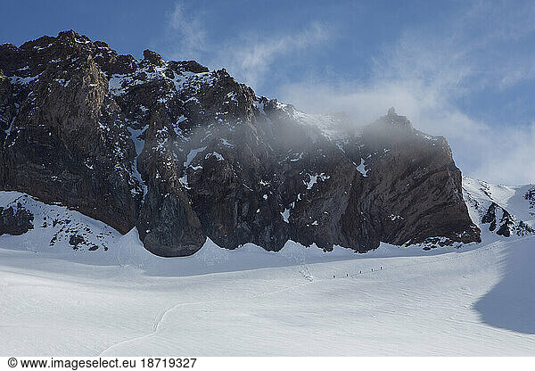 A Climbing Rope Team Ascends the Trail Above Camp Muir on Mt Rainier