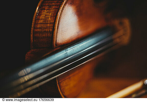 A close up shot of the details of a violin